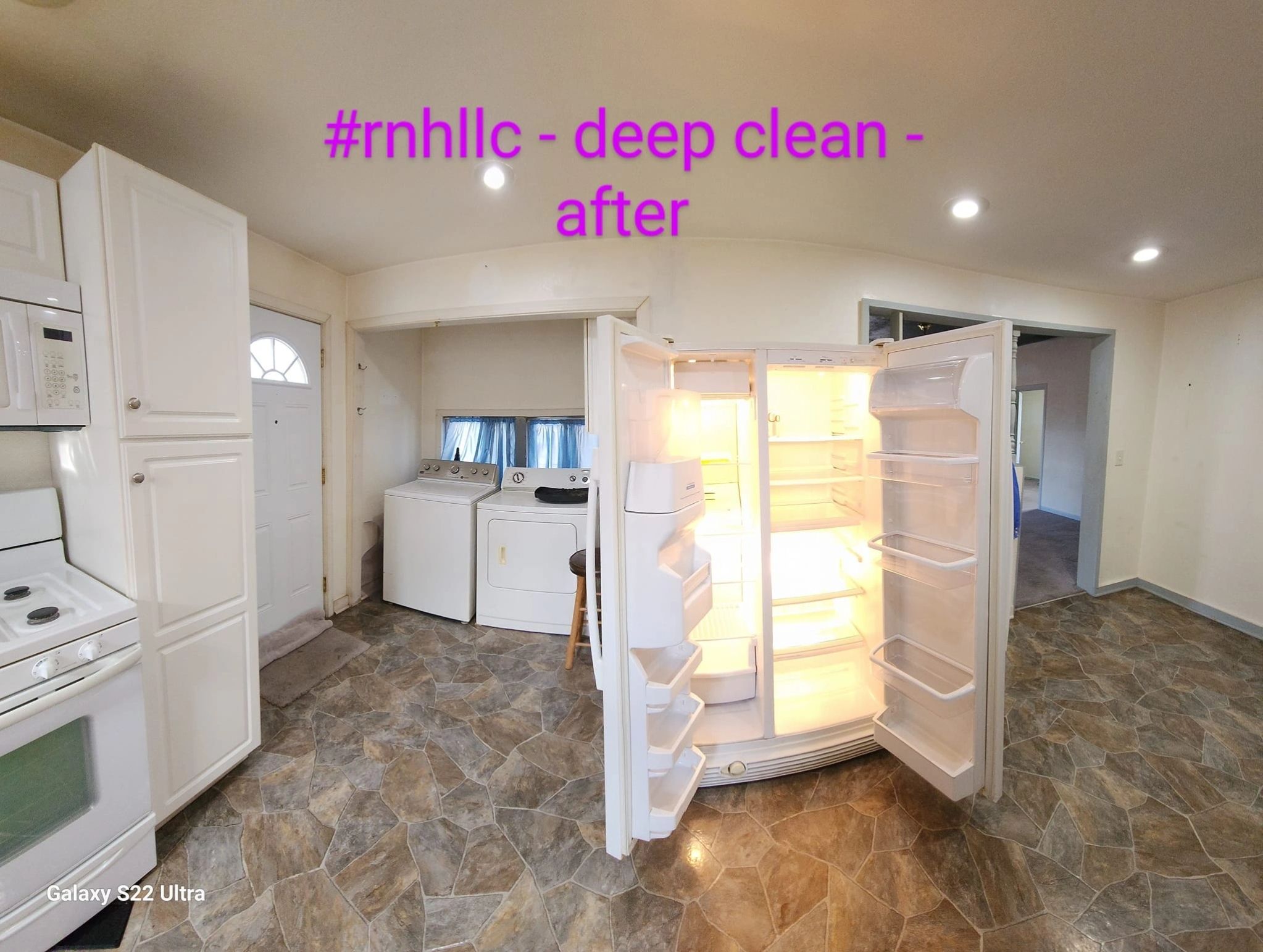 Fully cleaned kitchen with open refrigerator, laundry nook, and spotless tile floor after a deep clean